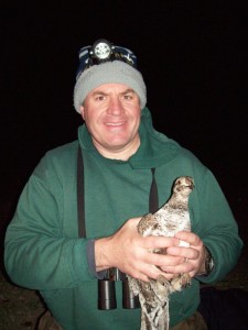 Scientist Jeff Beck with a sage grouse captured as part of a habitat study. Photo courtesy Jeff Beck.