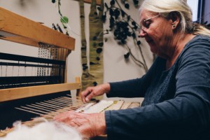 Doris Florig weaving in her studio at the Teton Science Schools Kelly Campus. Photo by Mac Staryk.
