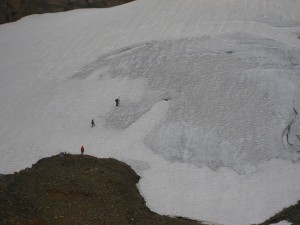 Jenny Lake Rangers surveying the lower reaches of Schoolroom Glacier in 2014.