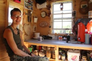 Murphy Robinson sits in the kitchen of her tiny home on wheels. Courtesy Murphy Robinson.
