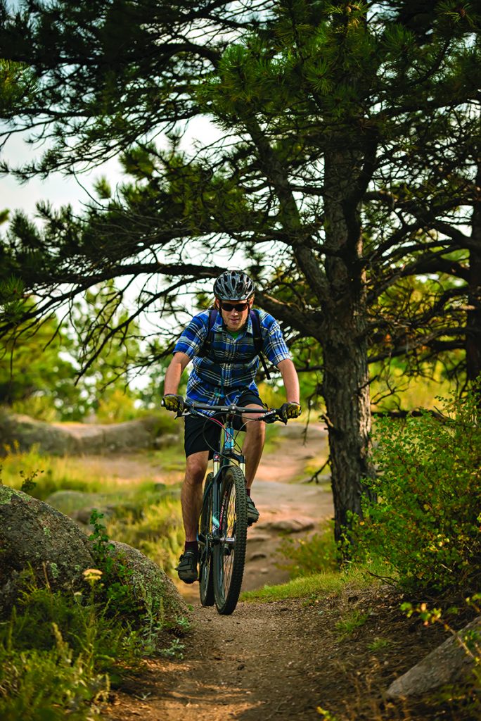 UW Graduate Student Michael Hague mountain bikes at Curt Gowdy State Park along the Stone Temple Circuit Trail. Michael, from Lilburn, Ga., is in the Zoological and Physiological studies.