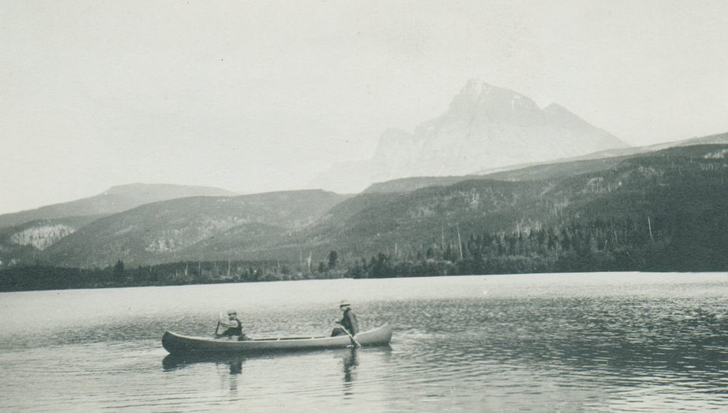 Two people on a canoe in a lake