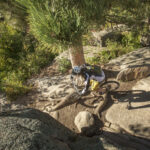 A mountain biker threads between boulders at Curt Gowdy State Park. (Brian Harrington/BHP Imaging)