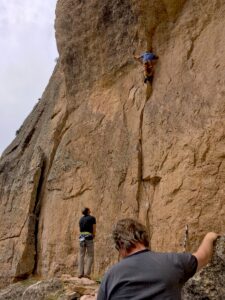 Photo of one climber belaying another on a route in Tensleep Canyon, Wyoming.